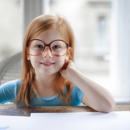 Young girl smiles for a photo.