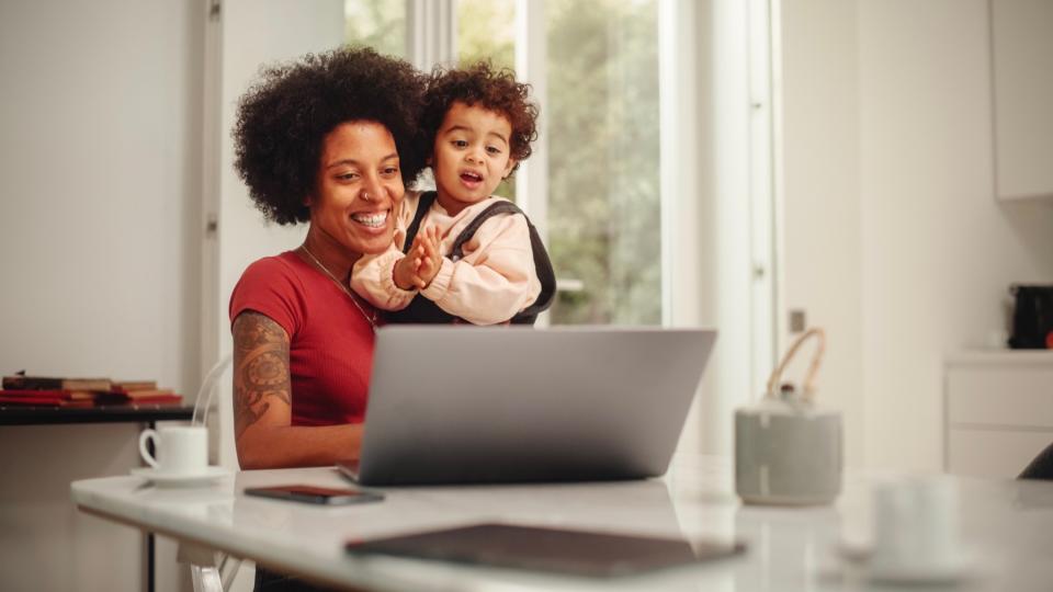 Mom and son on laptop. 